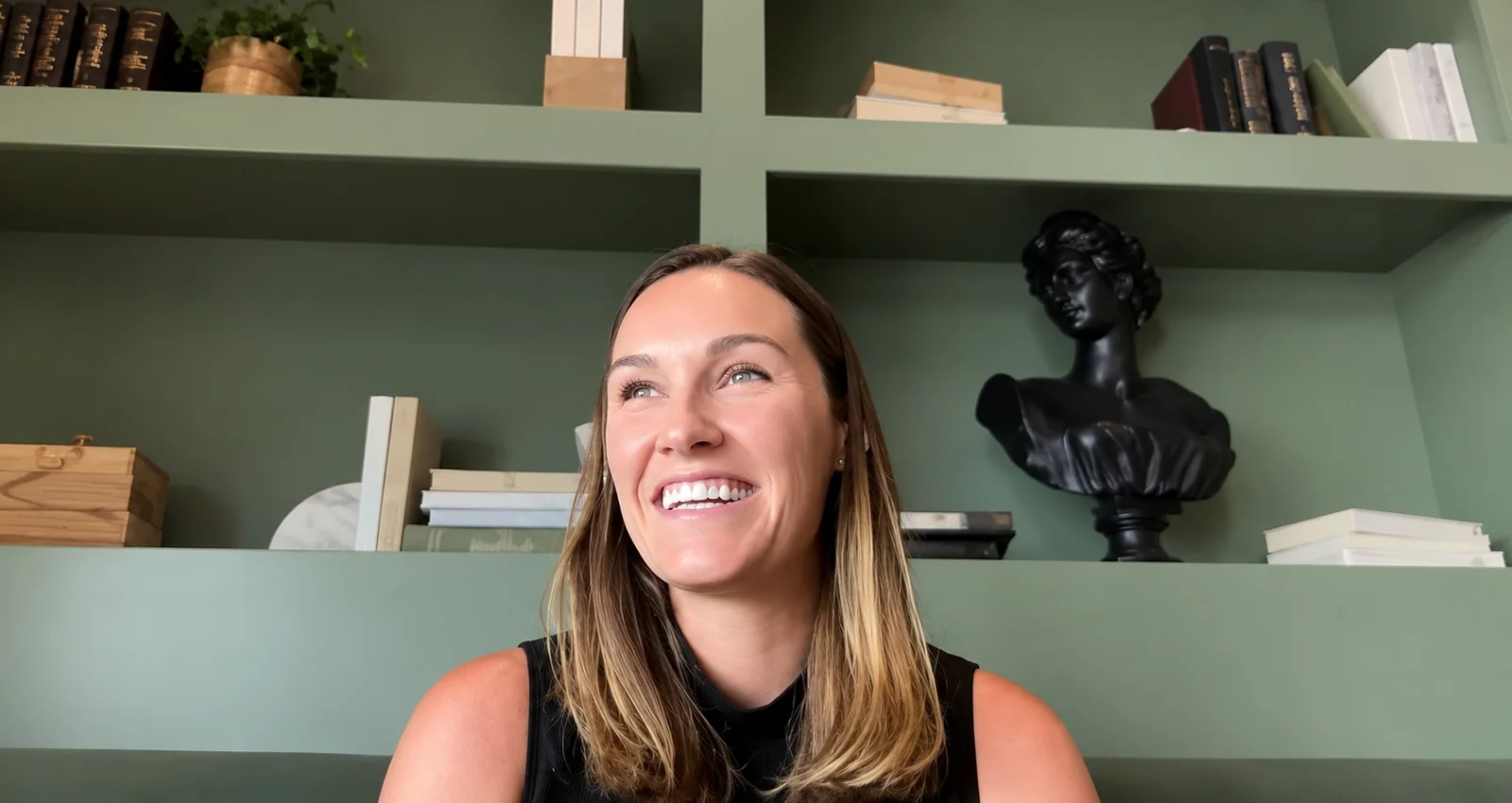 Megan Pitcher, Chief Marketing Officer of Oluna, smiling during the interview